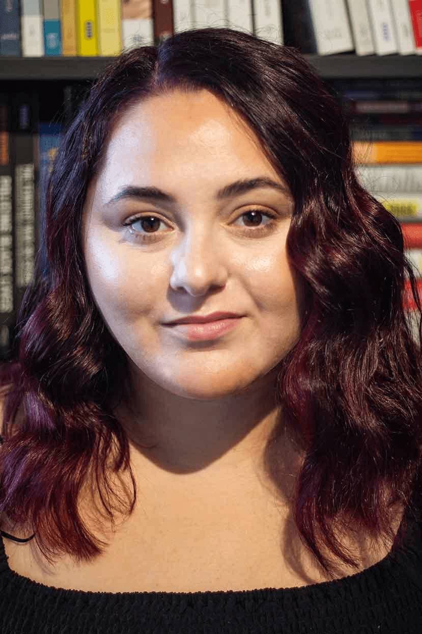Professional portrait of Jessica Stallone in a library